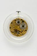 mécanisme d'horloge (mouvement de montre mécanique Parrenin HP 87) et son présentoir